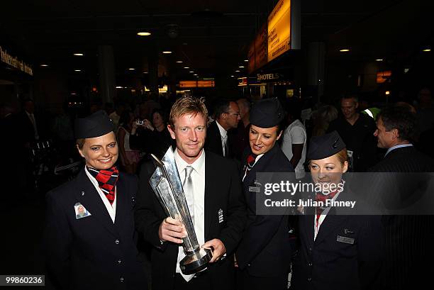 Captain, Paul Collingwood of England with the World Twenty20 Cup Trophy as he returns at Gatwick Airport on May 18, 2010 in London, England.