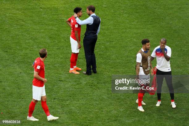 Gareth Southgate, Manager of England consoles Jesse Lingard following the 2018 FIFA World Cup Russia 3rd Place Playoff match between Belgium and...