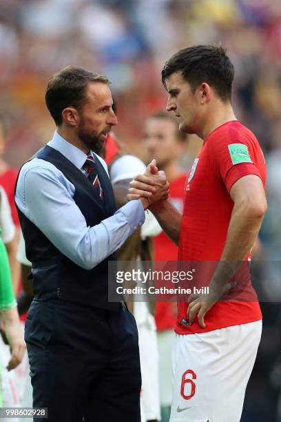 Gareth Southgate, Manager of England speaks with Harry Maguire of England after the 2018 FIFA World Cup Russia 3rd Place Playoff match between...