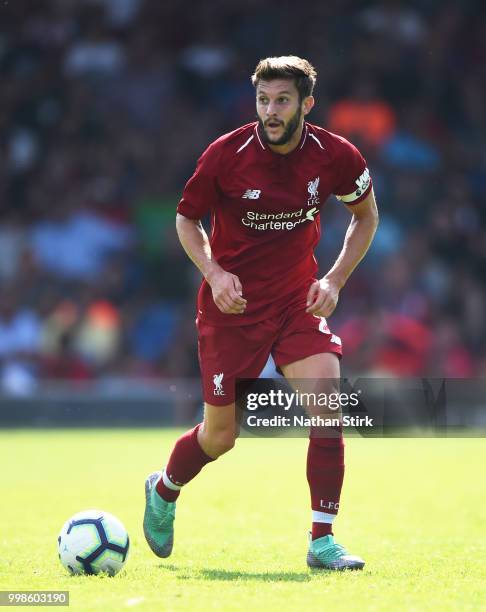 Adam Lallana of Liverpool in action during a pre-season friendly match between Bury and Liverpool at Gigg Lane on July 14, 2018 in Bury, England.