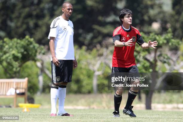 Head coach Joachim Loew of Germany instructs Jerome Boateng during the German National Team training session at Verdura Golf and Spa Resort on May...