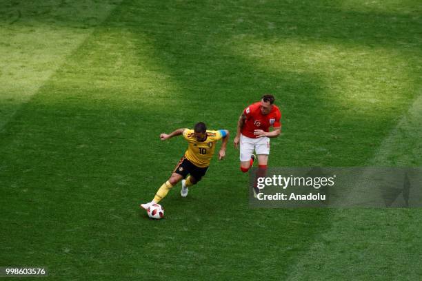 Phil Jones of England in action against Eden Hazard of Belgium during the 2018 FIFA World Cup Russia Play-Off for Third Place between Belgium and...