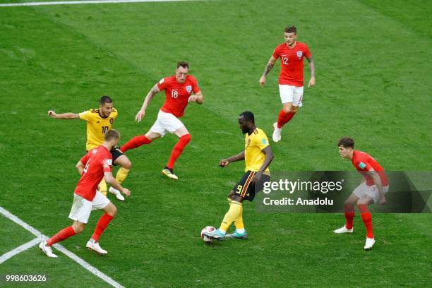 John Stones , Kieran Trippier and Phil Jones of England in action against Romelu Lukaku of Belgium during the 2018 FIFA World Cup Russia Play-Off for...