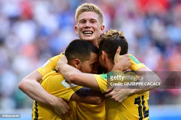 Belgium's forward Eden Hazard celebrates with Belgium's forward Dries Mertens and Belgium's midfielder Kevin De Bruyne after scoring their second...