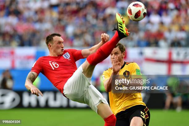 England's defender Phil Jones makes a bicycle kick past Belgium's defender Jan Vertonghen during their Russia 2018 World Cup play-off for third place...