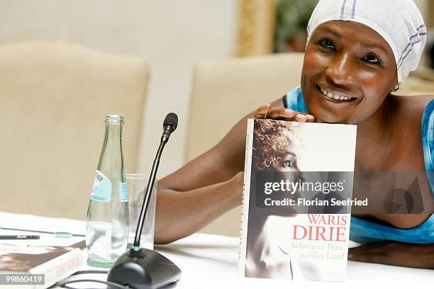 Model, writer Waris Dirie poses for the media during her book presentation of 'Schwarze Frau, Weisses Land' at Hotel Adlon on May 18, 2010 in Berlin,...