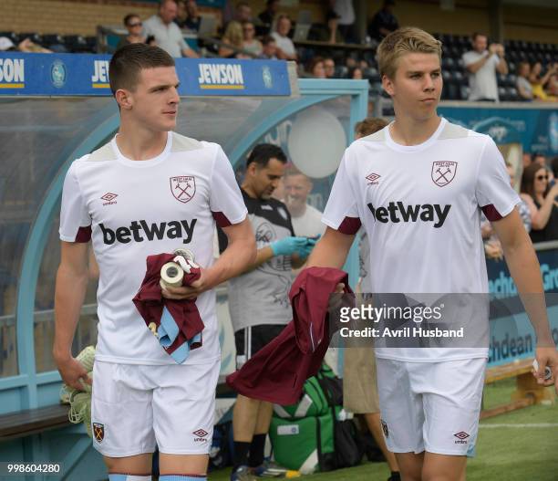 Declan Rice and Martin Samuelsen of West Ham United come out ahead of kick off prior to the pre season friendly between Wycombe Wanderers and West...