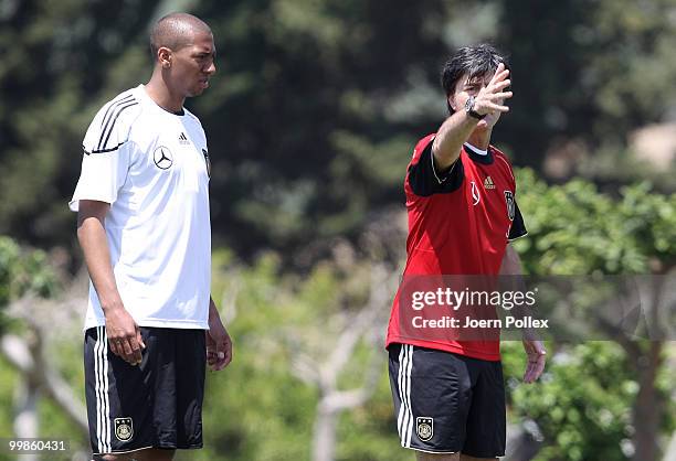 Head coach Joachim Loew of Germany instructs Jerome Boateng during the German National Team training session at Verdura Golf and Spa Resort on May...