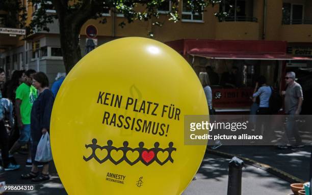 July 2018, Germany, Berlin: "No place for racism!" on a balloon at Kollwitzplatz. The Israeli Zeev Avrahami was insulted by a salesman. Photo: Paul...