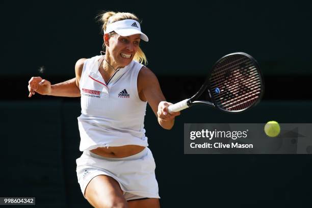 Angelique Kerber of Germany returns against Serena Williams of The United States during the Ladies' Singles final on day twelve of the Wimbledon Lawn...