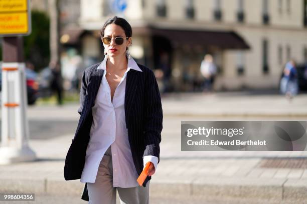 Guest wears a shirt and a black blazer jacket, outside Dries Van Noten, during Paris Fashion Week - Menswear Spring-Summer 2019, on June 21, 2018 in...