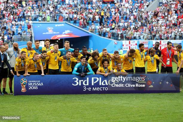 Belgium players pose for a photo after recieving their third place medals during the 2018 FIFA World Cup Russia 3rd Place Playoff match between...