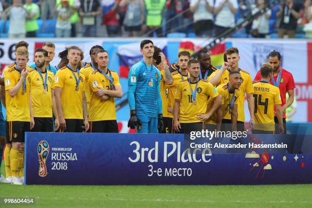 Belgium players pose for a photo after recieving their third place medals during the 2018 FIFA World Cup Russia 3rd Place Playoff match between...