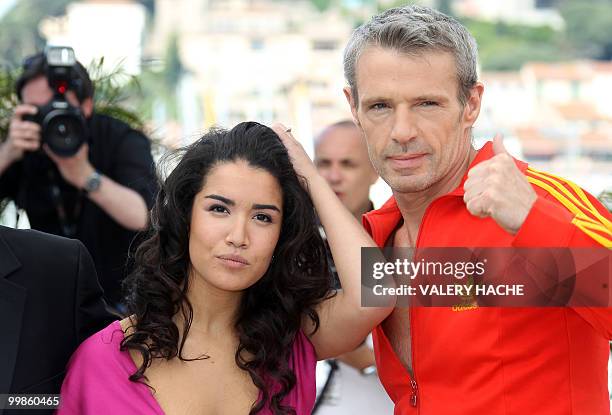 French actress Sabrina Ouazani and French actor Lambert Wilson pose during the photocall of "Des Hommes et des Dieux" presented in competition at the...