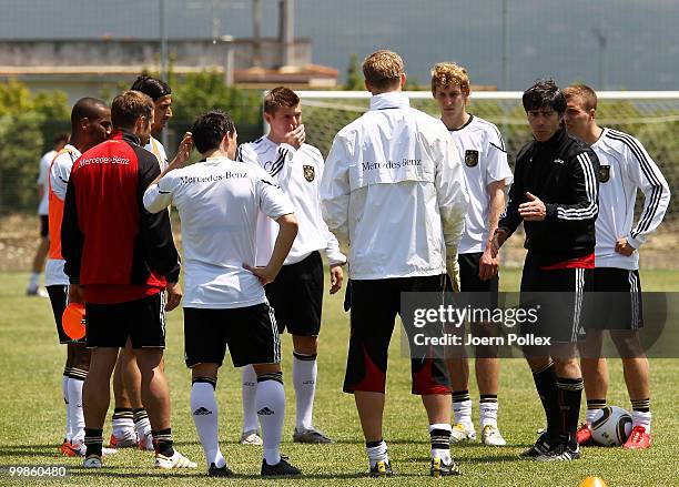 Head coach Joachim Loew of Germany talks to some players during the German National Team training session at Verdura Golf and Spa Resort on May 18,...