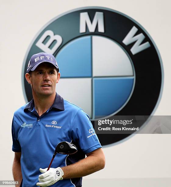 Padraig Harrington of Ireland watches his tee shot on the third hole during a practice round at Wentworth prior to the BMW PGA Championship on May...