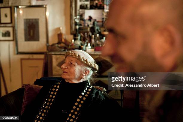 The artist Carol Rama meets the fashion designer Antonio Marras in her home on March 03, 2009 in Turin, Italy.