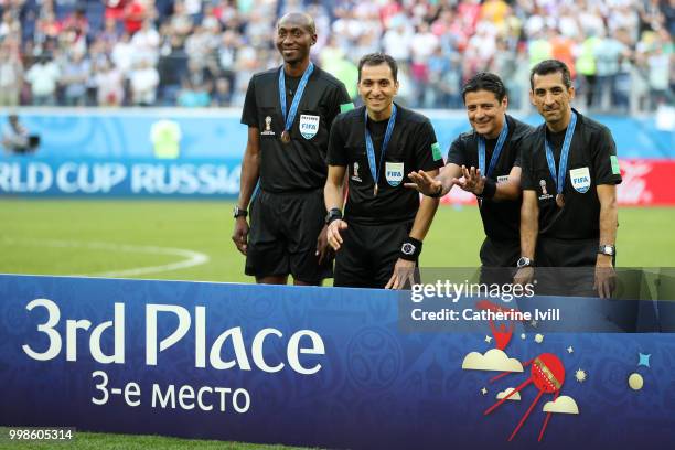 Assistant referee Mohammadreza Mansouri, Fourth official Malang Diedhiou, Referee Alireza Faghani and Assistant referee Reza Sokhandan pose with...