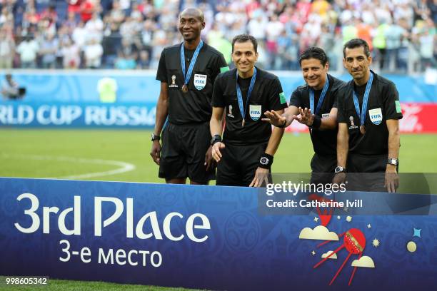 Assistant referee Mohammadreza Mansouri, Fourth official Malang Diedhiou, Referee Alireza Faghani and Assistant referee Reza Sokhandan pose with...