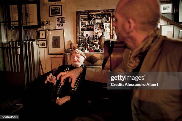 The artist Carol Rama meets the fashion designer Antonio Marras in her home on March 03, 2009 in Turin, Italy.