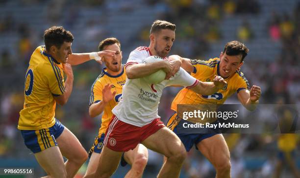 Dublin , Ireland - 14 July 2018; Niall Sludden of Tyrone in action against Tadhg O'Rourke, right, Conor Devaney and Ciarain Murtagh of Roscommon ,...