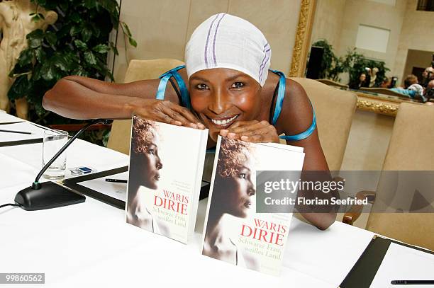 Model, writer Waris Dirie poses for the media during her book presentation of 'Schwarze Frau, Weisses Land' at Hotel Adlon on May 18, 2010 in Berlin,...