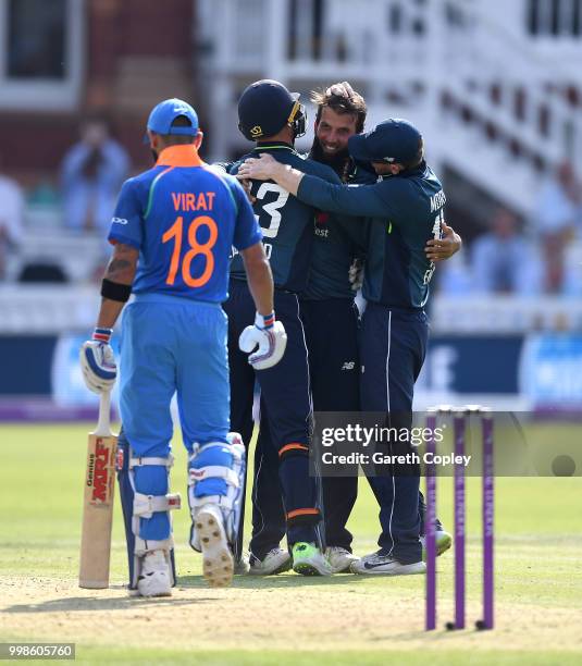 Moeen Ali of England celebrates dismissing India captain Virat Kohli during the 2nd ODI Royal London One-Day match between England and India at...