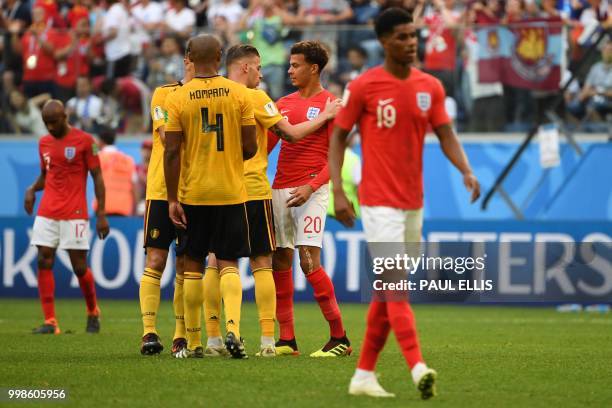Belgium's defender Toby Alderweireld talks to England's midfielder Dele Alli after their Russia 2018 World Cup play-off for third place football...
