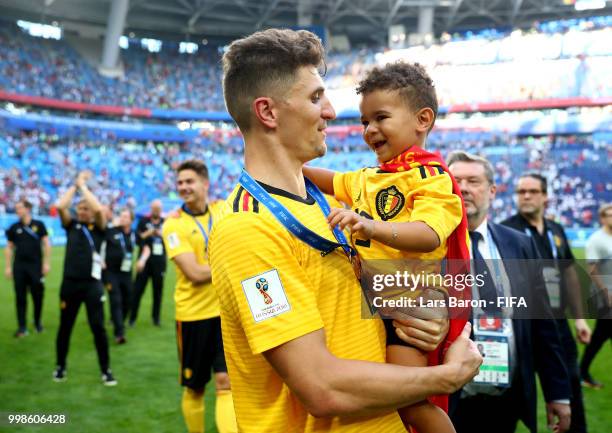 Thomas Meunier of Belgium celebrates with his son following his sides victory in the 2018 FIFA World Cup Russia 3rd Place Playoff match between...