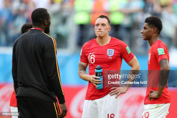 Romelu Lukaku of Belgium talks with Manchester United teammates Jesse Lingard, Phil Jones and Marcus Rashford of England as they wait for medal...