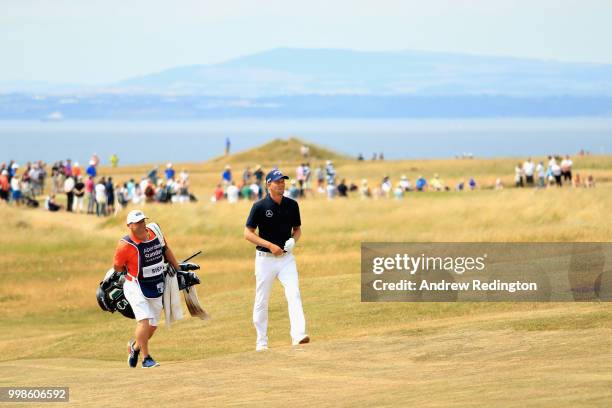 Marcel Siem of Germany walks with his caddy on hole four during day three of the Aberdeen Standard Investments Scottish Open at Gullane Golf Course...