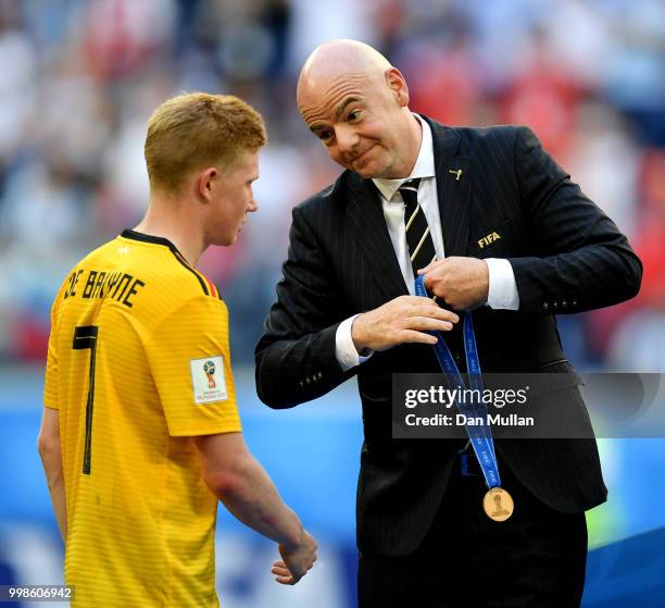 President, Gianni Infantino, awards Kevin De Bruyne of Belgium with his third place medal after the 2018 FIFA World Cup Russia 3rd Place Playoff...