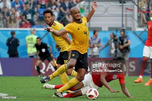 Marcus Rashford of England is checked by Vincent Kompany of Belgium during the 2018 FIFA World Cup Russia 3rd Place Playoff match between Belgium and...