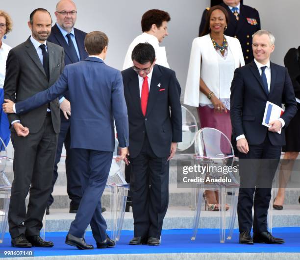 French President Emmanuel Macron greets French Prime Minister Edouard Philippe , Japanese Foreign Minister Taro Kono and French National Assembly...