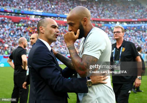 Roberto Martinez, Head coach of Belgium celebrates with Belgium Assistant Coach, Thierry Henry following their sides victory in the 2018 FIFA World...