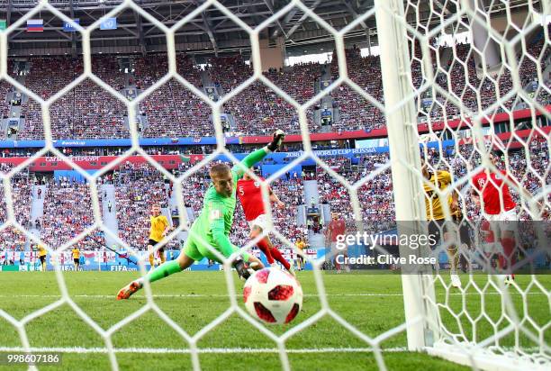 Eden Hazard of Belgium scores Jordan Pickford of England his team's second goal during the 2018 FIFA World Cup Russia 3rd Place Playoff match between...