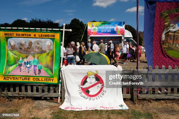 Colliery banners and an anti-Trump banner are fastened to railings during the 134th Durham Miners' Gala on July 14, 2018 in Durham, England. Over two...