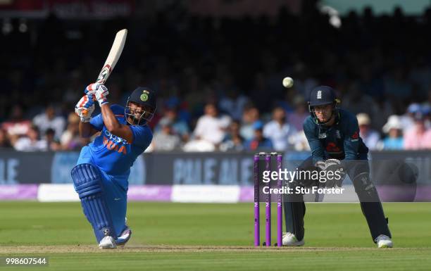 India batsman Suresh Raina hits out watched by Jos Buttler during the 2nd ODI Royal London One Day International match between England and India at...