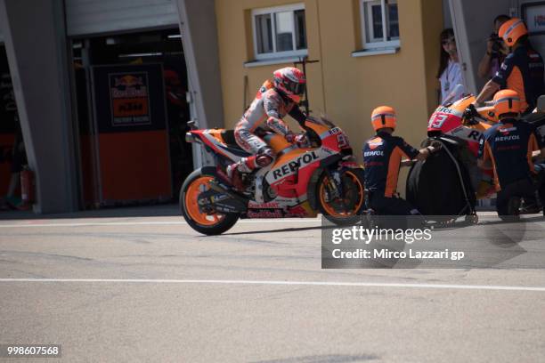 Marc Marquez of Spain and Repsol Honda Team changes the bikes in front of box during the qualifying practice during the MotoGp of Germany -...