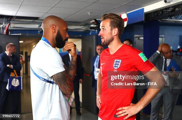Harry Kane of England talks to Belgium assistant manager Thierry Henry following the 2018 FIFA World Cup Russia 3rd Place Playoff match between...