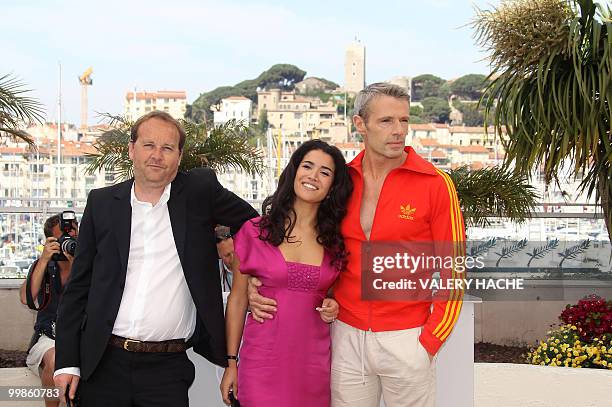 French director Xavier Beauvois, French actress Sabrina Ouazani and French actor Lambert Wilson pose during the photocall of "Des Hommes et des...