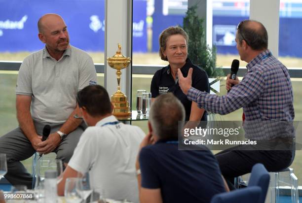 Ryder Cup Captain Thomas Bjorn of Denmark , with Solheim Cup Captain Catriona Matthew of Scotland during an interview with Ian Carter of the BBC , on...