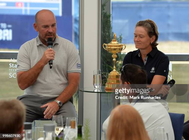 Ryder Cup Captain Thomas Bjorn of Denmark , with Solheim Cup Captain Catriona Matthew of Scotland during an interview with Ian Carter of the BBC on...