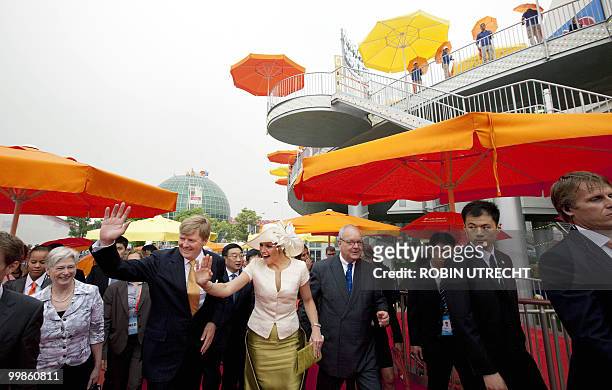 Dutch crown prince Willem-Alexander and his wife princess Maxima wave to the crowd as they visit the World Expo 2010 in Shanghai, on the National Day...