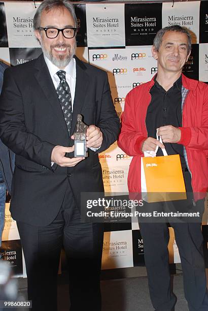 Alex de la Iglesia receives the Jorge Fiestas Award together with Inaki Miramon during the 'Orange and Lemon' Awards on May 17, 2010 in Madrid,...