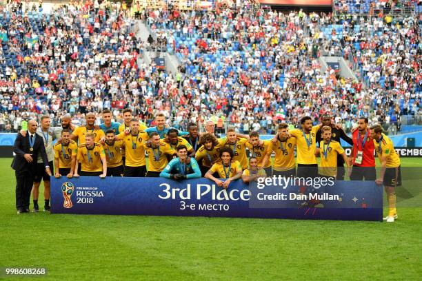 Belgium players pose for a photo after receiving their third place medals during the 2018 FIFA World Cup Russia 3rd Place Playoff match between...