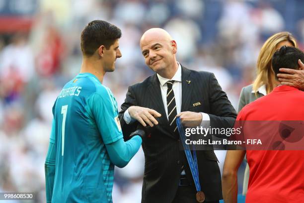 President, Gianni Infantino, awards Thibaut Courtois of Belgium with his third place medal after the 2018 FIFA World Cup Russia 3rd Place Playoff...