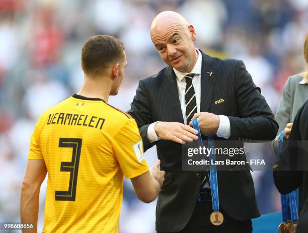 President, Gianni Infantino, awards Thomas Vermaelen of Belgium with his third place medal after the 2018 FIFA World Cup Russia 3rd Place Playoff...