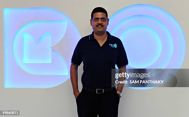 Nipun Sharma, Tata DOCOMO's Chief Operating Officer for Gujarat, poses in front of company signage during the launch of company's first Dive-in Store...