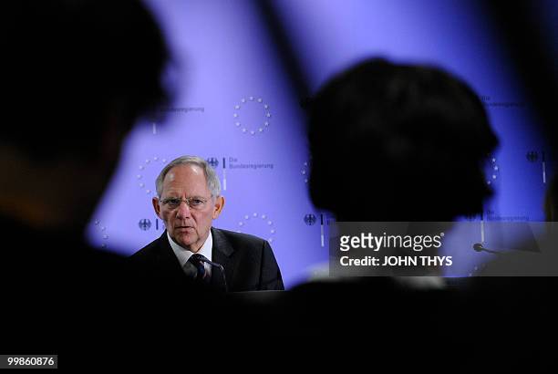 German Finance Minister Wolfgang Schaeuble listens to journalists questions during a press conference after an Economic and Financial Affairs meeting...